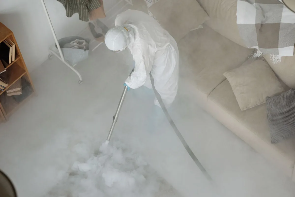 Biohazard cleanup technician in protective equipment, Utica, SC